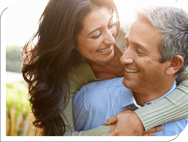 A man and woman smiling for the camera.